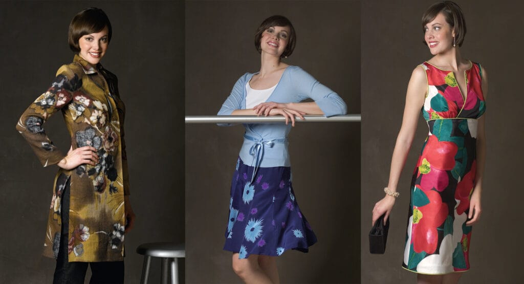 Three images of a woman posing in different outfits: a floral patterned coat, a light blue top with a purple floral skirt, and a sleeveless dress with bold floral and fruit patterns, holding a clutch.